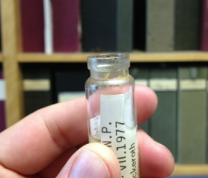 Trouble in the collection: A vial with a cracked glass lip.